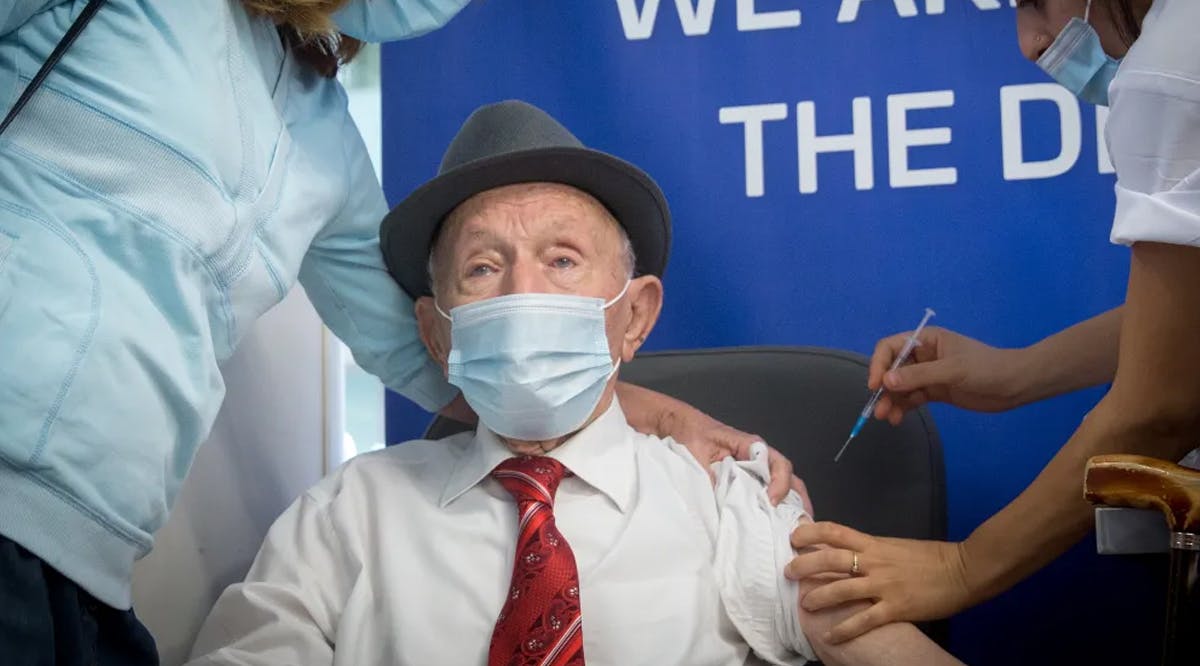 102-year-old Holocaust survivor Yehuda Widawsky receives a third dose of the Covid-19 vaccine