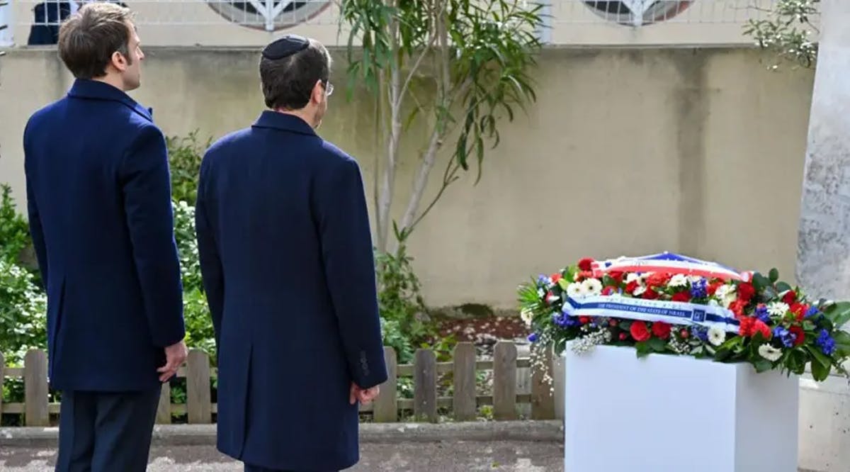 French President Emmanuel Macron (L) and Israeli President Isaac Herzog at the Ohr Torah Jewish school in Toulouse, France