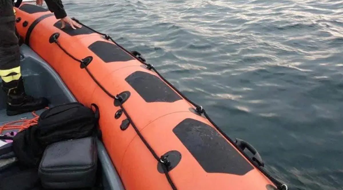 Firefighters search for survivors after a tourist boat capsized in Lake Maggiore