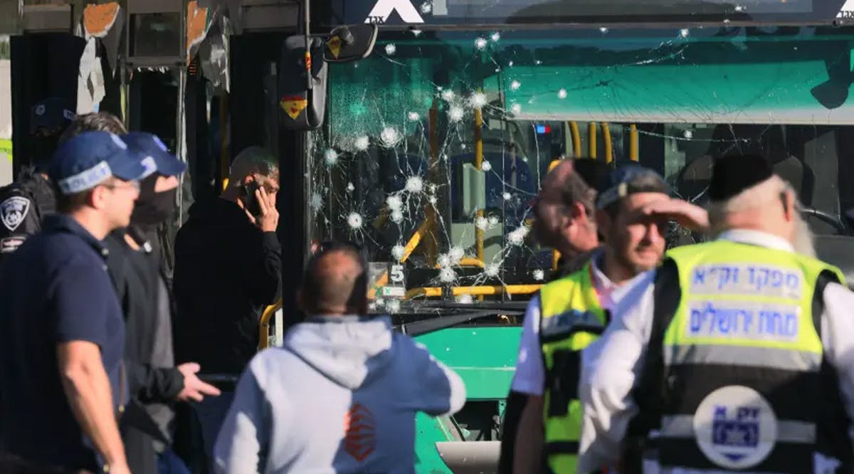 Israeli security forces and medics gather in Jerusalem following an explosion at a bus stop which wounded at least seven people