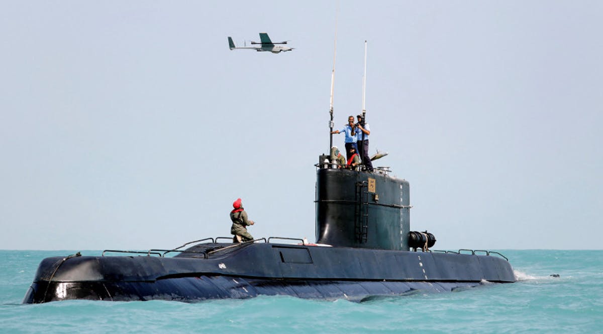 A drone is launched from an Iranian submarine during a military exercise in an undisclosed location in Iran