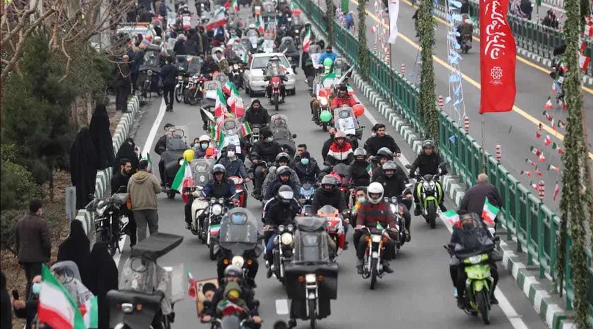 Iranians ride on motorcycles as they participate in the celebration of the 43rd anniversary of the Islamic Revolution in Tehran, Iran