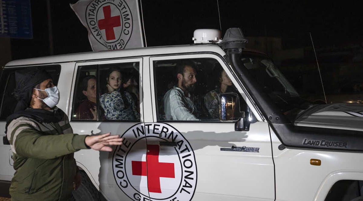 A Red Cross vehicle carrying Israeli hostages