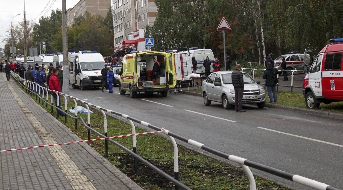 Police and paramedics work at the scene of a shooting at school No. 88 in Izhevsk, Russia