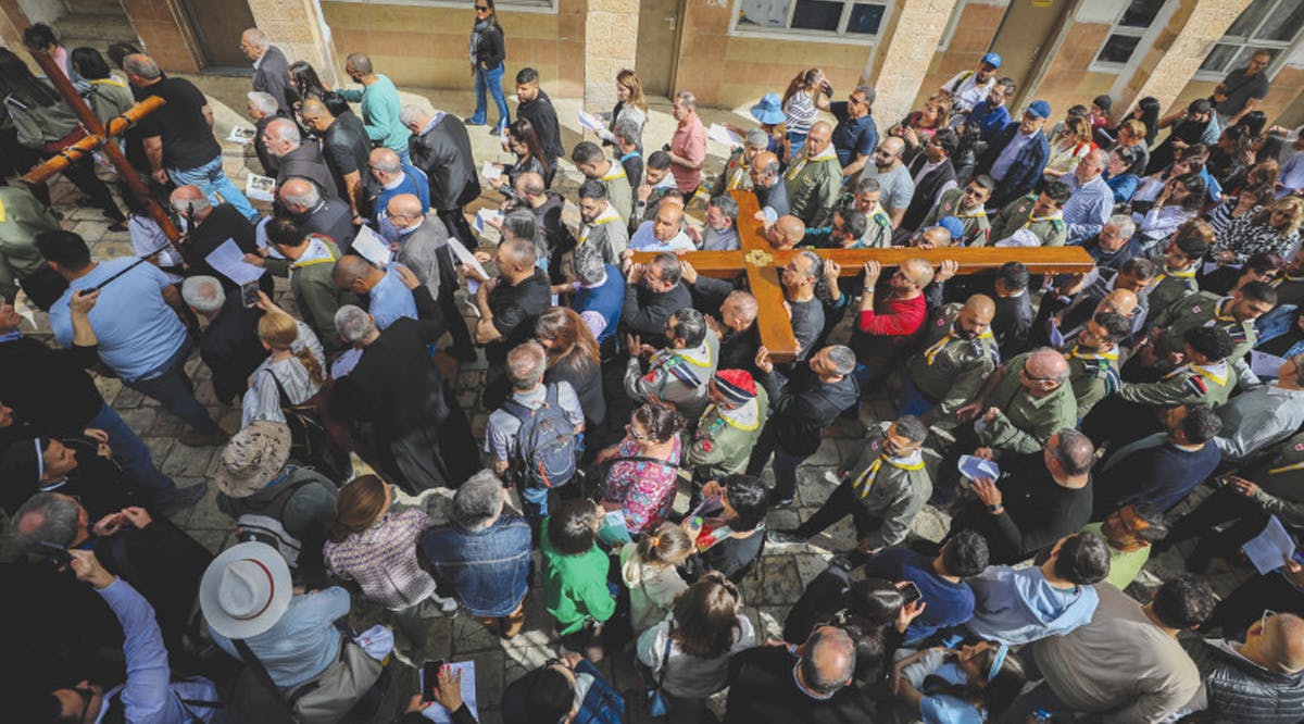 Christian Worshipers take part in a Good Friday procession in Jerusalem’s Old City