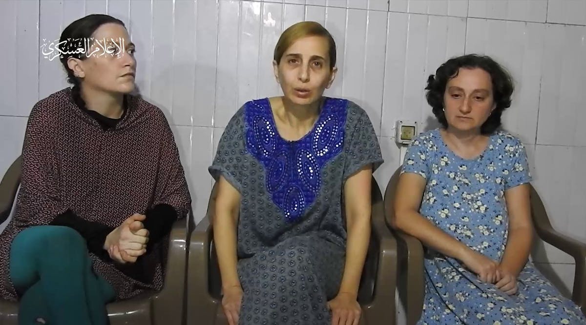 A screenshot from a propaganda video released by Hamas on October 30, 2023, showing three Israeli hostages: Rimon Buchshtab Kirsht (left), Danielle Aloni (center), and Lena Trupanov (right)