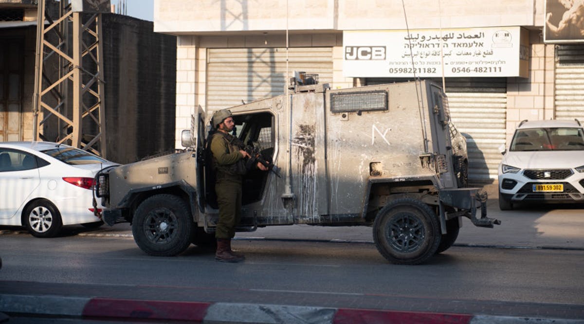 IDF soldiers at the scene of a shooting attack in Huwara in the northern West Bank