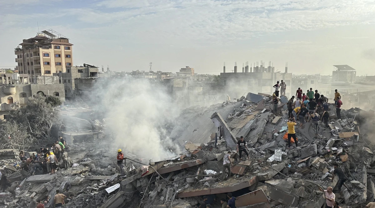 Palestinians look for survivors following an Israeli airstrike