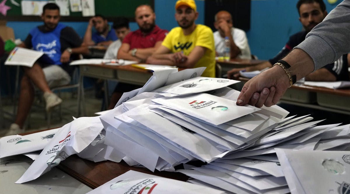 Election officials count ballots shortly after polling stations closed, in the northern city of Tripoli, Lebanon