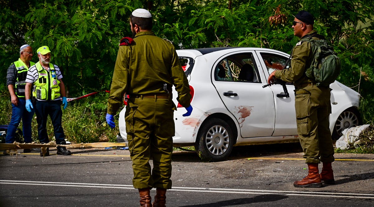 Soldiers at the scene of a deadly terrorist shooting attack in the West Bank