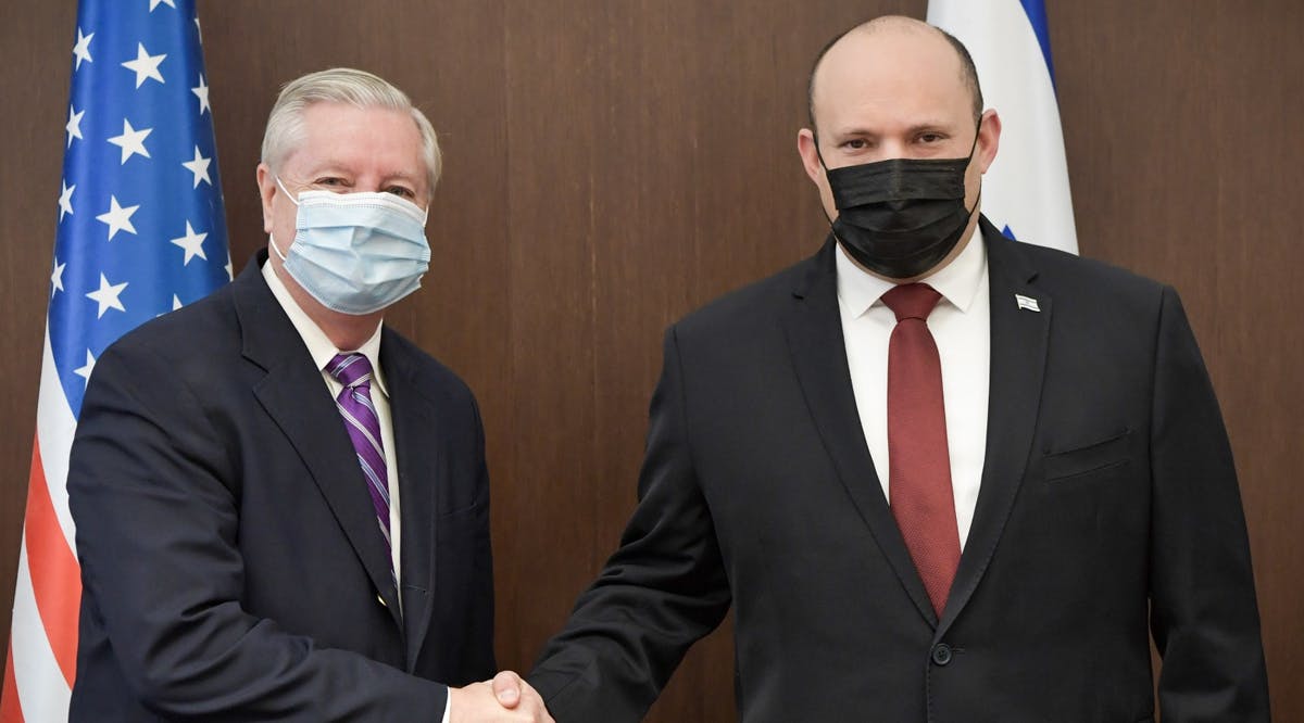 Prime Minister Naftali Bennett (right) and US Senator Lindsey Graham meet at the Prime Minister's Office in Jerusalem