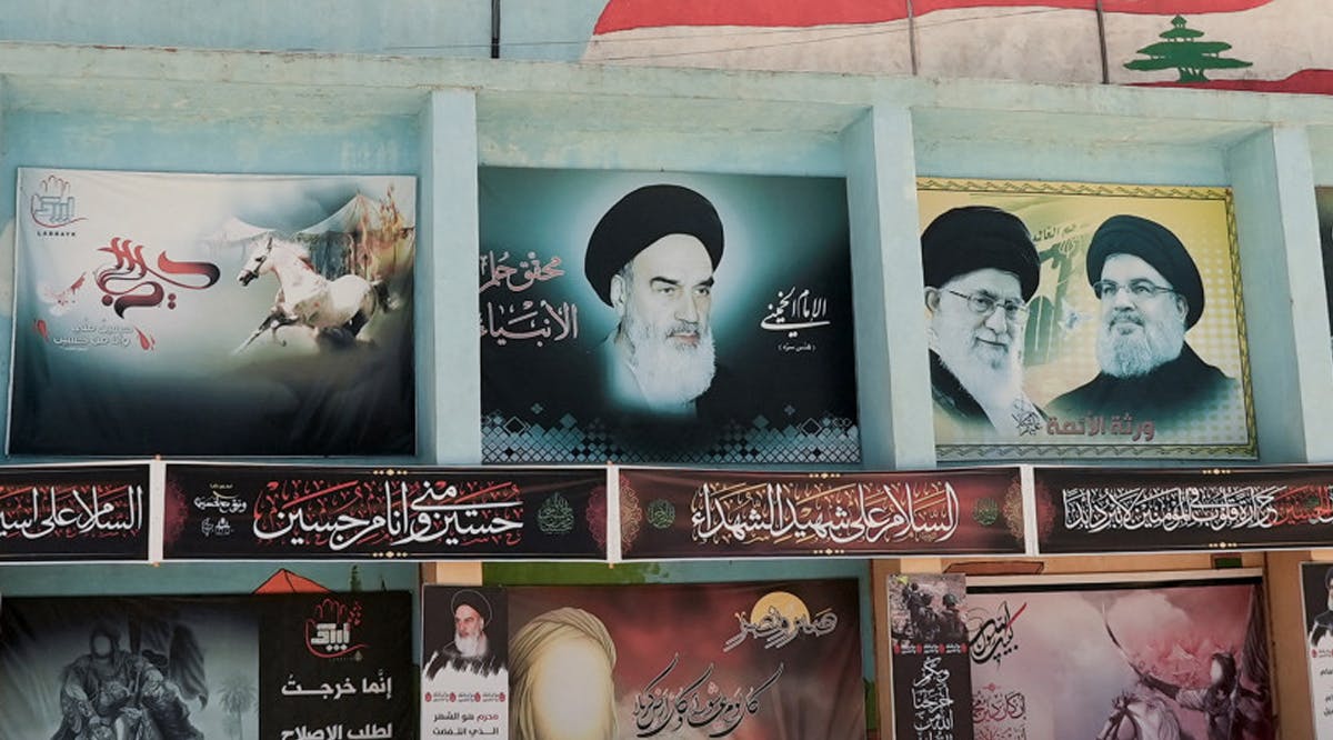Banners depict (from L) Iran’s late leader Ayatollah Ruhollah Khomeini, Iran’s Supreme Leader Ayatollah Ali Khamenei and Hezbollah leader Sayyed Hassan Nasrallah, in Yaroun, southern Lebanon