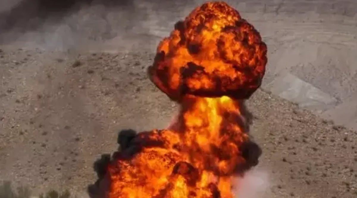 An explosion is seen at an Iranian missile and drone test
