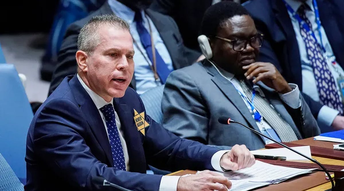 Israel’s U.N. Ambassador, Gilad Erdan, wears a yellow Star of David that reads "Never Again" in honor of those killed in the unprecedented attack by Hamas