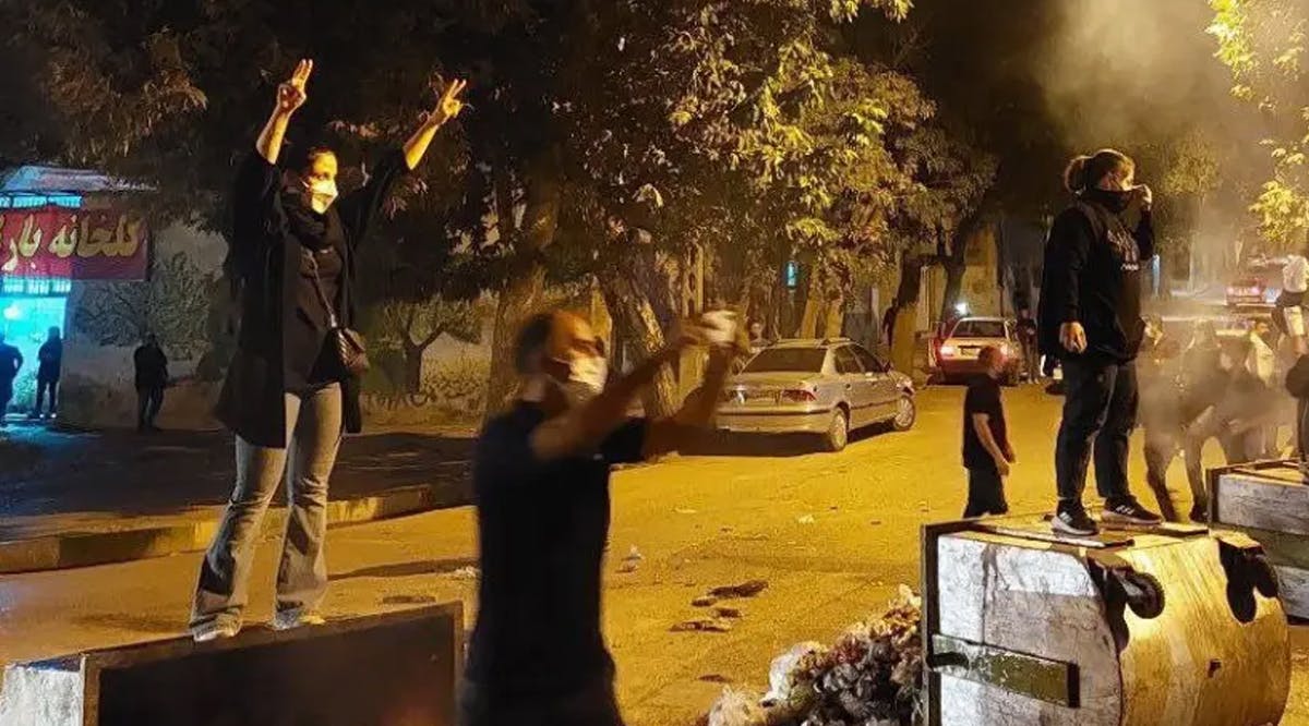 Iranian protesters stand in public without hijab