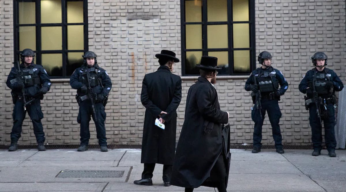 Police guard a Brooklyn synagogue