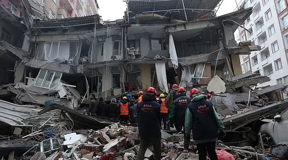 Rescue workers search for survivors in a collapsed building in Diyarbakir