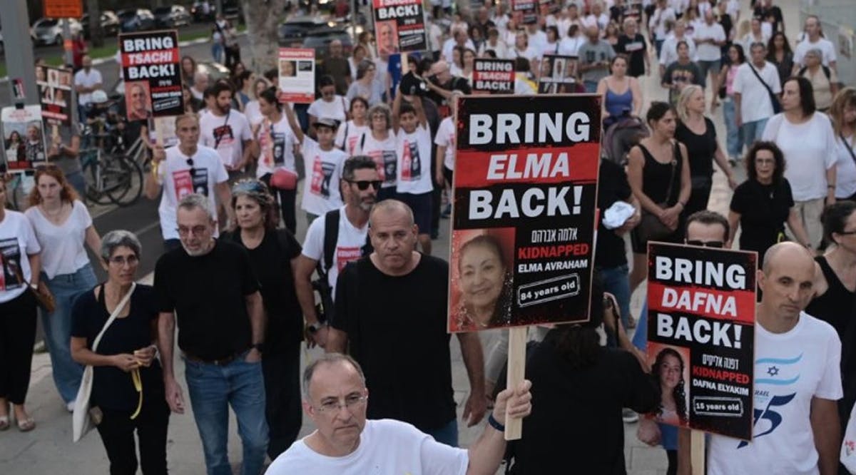 Thousands gather as families of hostages vow to not return home until their loved ones are freed