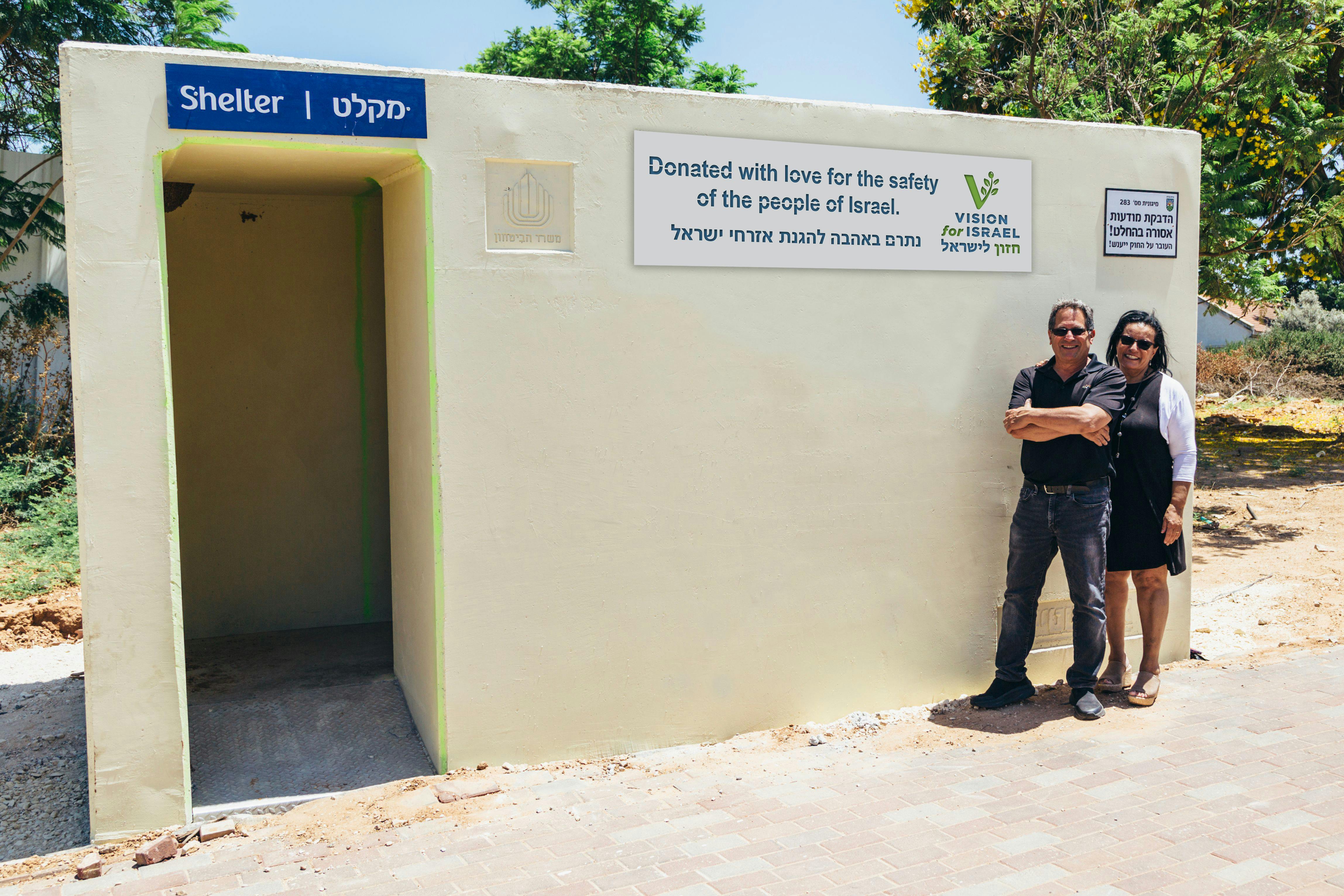 Barry & Batya next to a mobile shelter donated by VFI