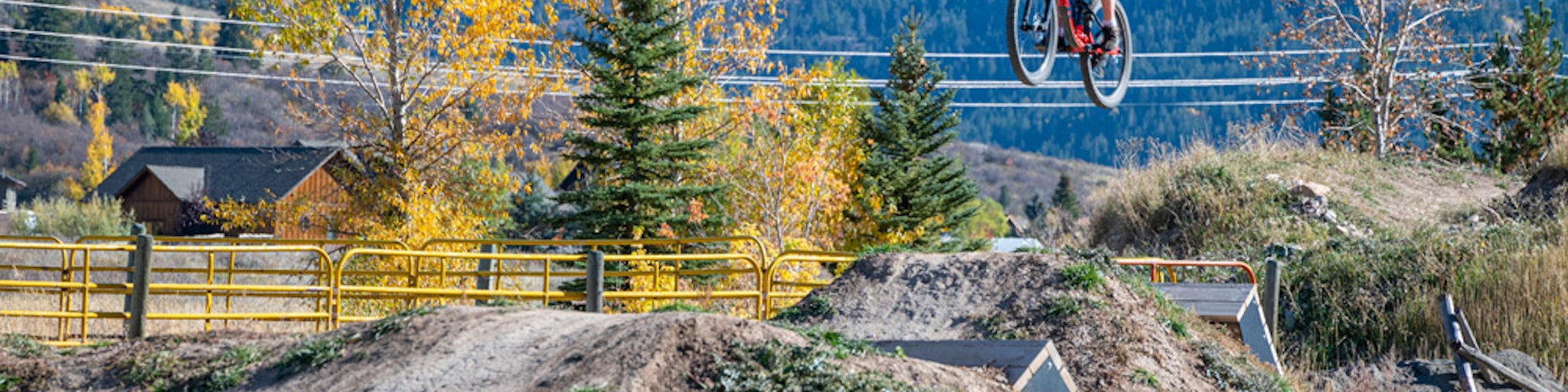 bike catching air on jump at Sherman Bike Park in Victor Idaho.