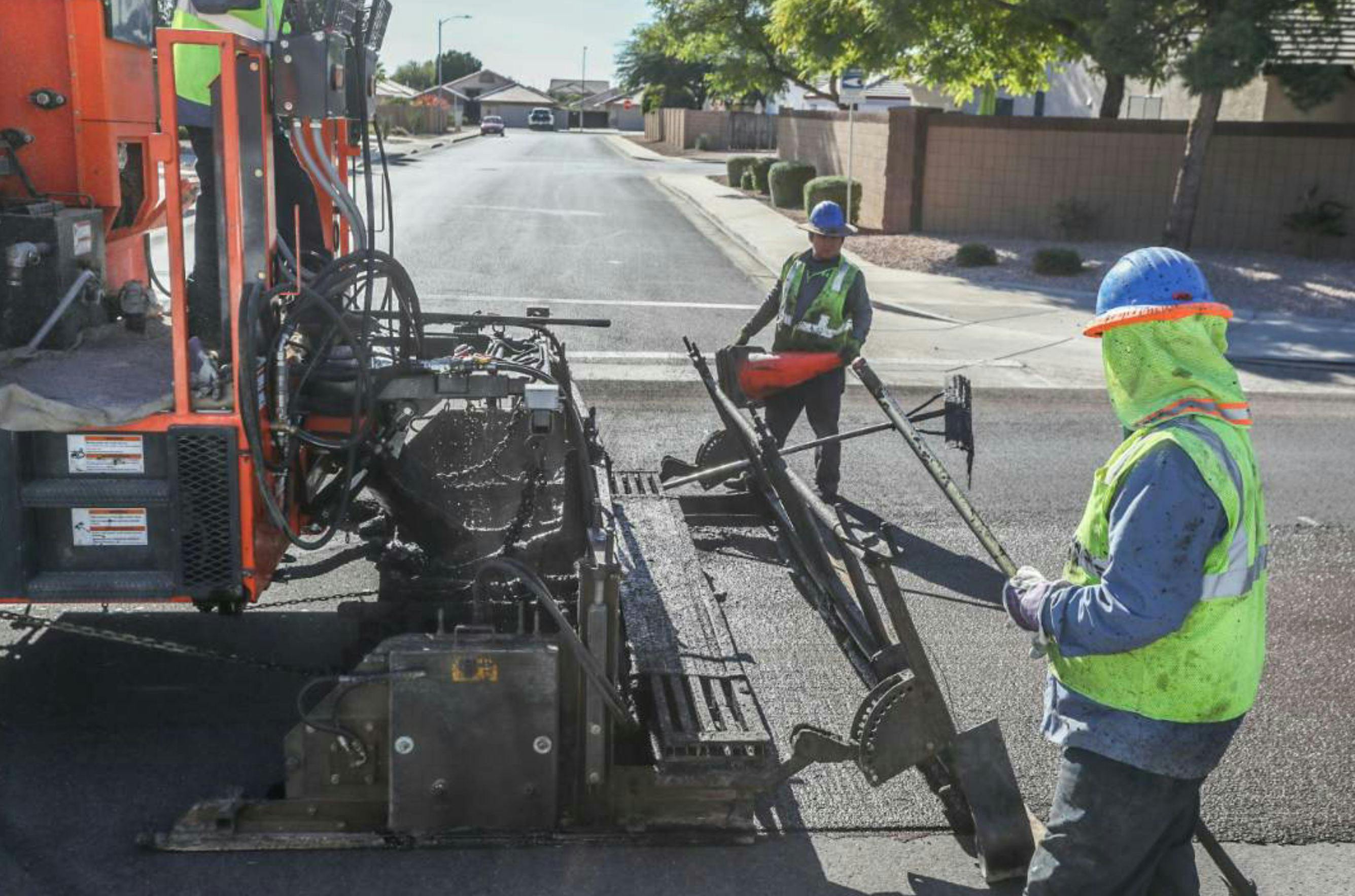 Free Vector  Cartoon workers paving road on highway. engineers