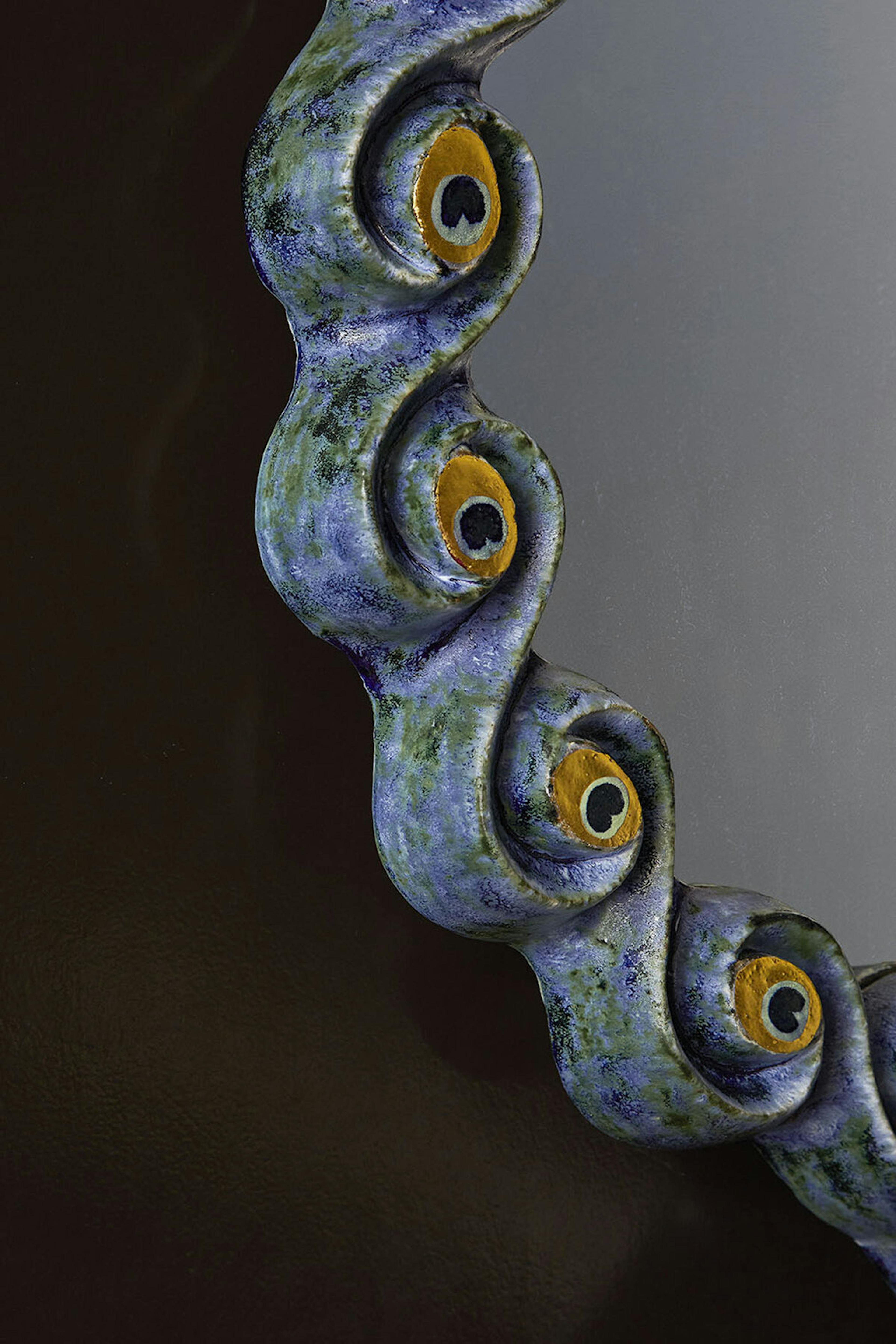 Peacock Mirror closeup on frame