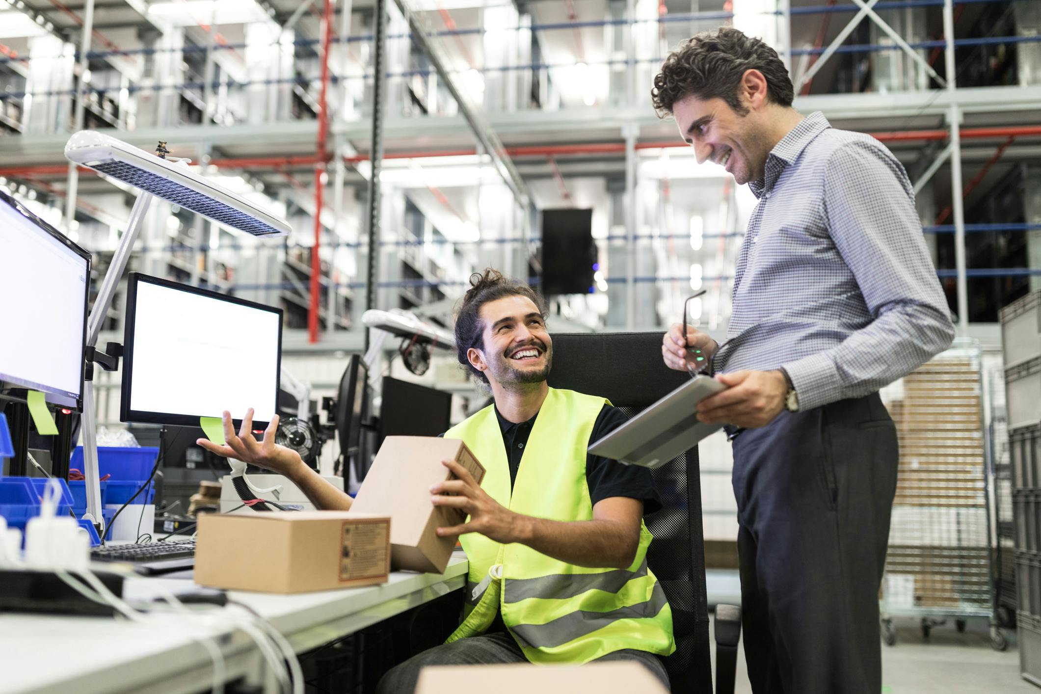 Employees in an automated warehouse: data collection, documentation and fast processes.
