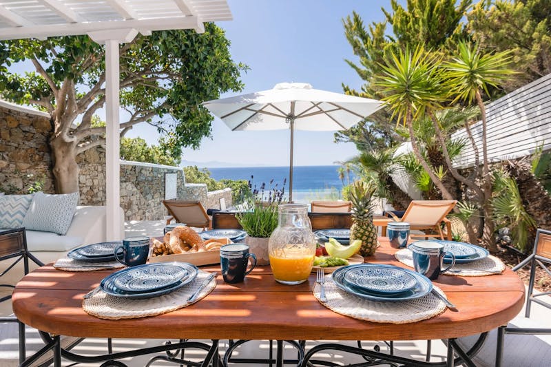 Outdoor Dinner area w pool & sea views