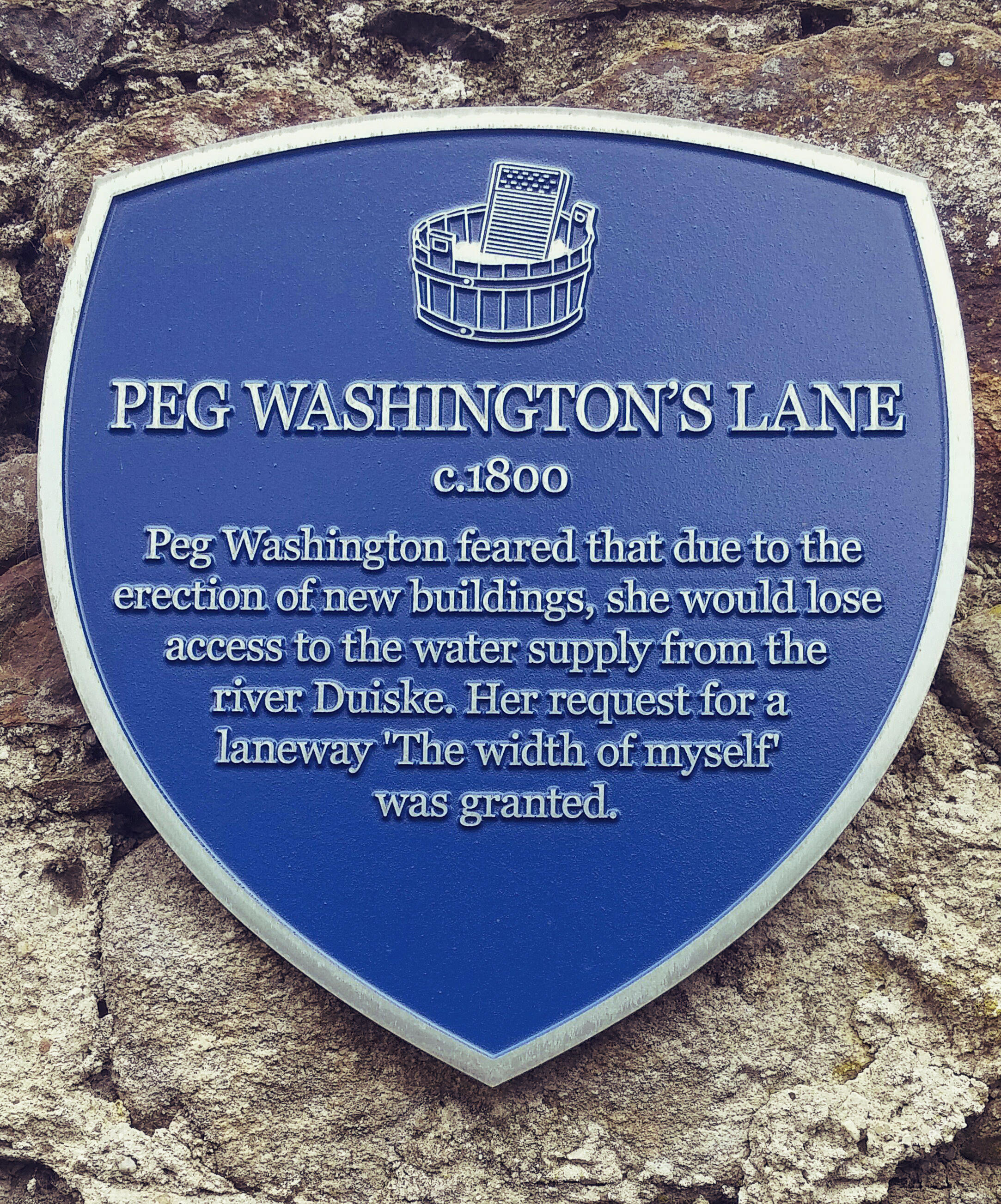 Plaque that describes how Peg Washingtons Lane came to be.
