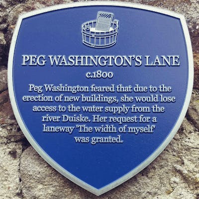 Plaque that describes how Peg Washingtons Lane came to be.