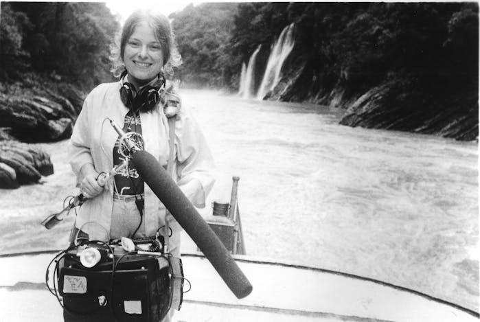 Woman holding microphone.