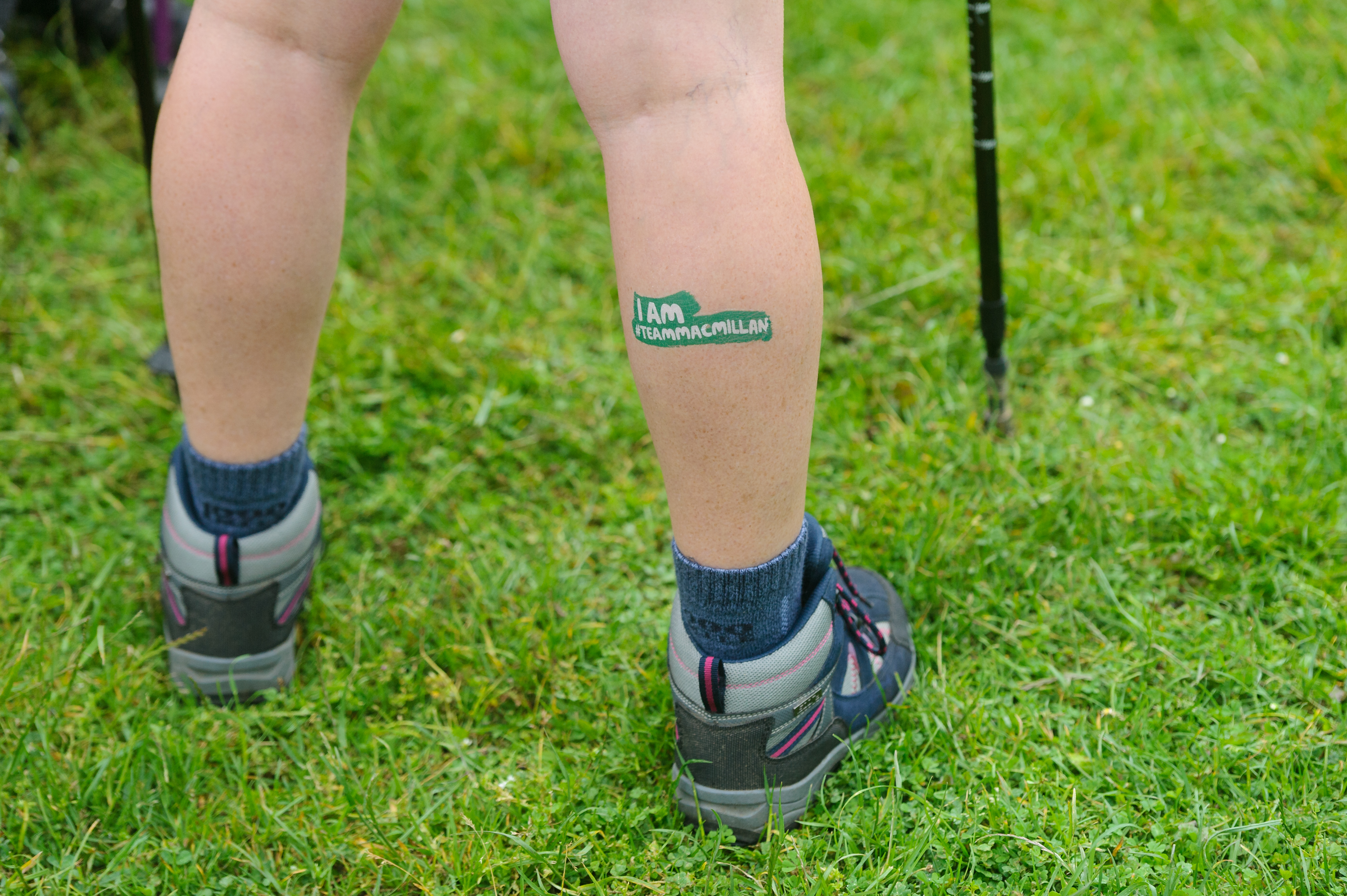 A person’s legs with a Macmillan temporary tattoo