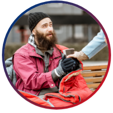 Homeless man receiving a warm drink 