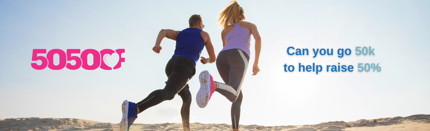 Man and woman jogging on sand - tag line says, Can you go 50K to help raise 50%