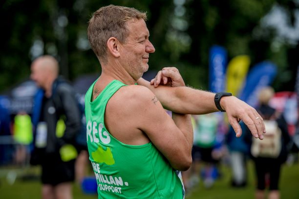 Macmillan challenge participant stretching