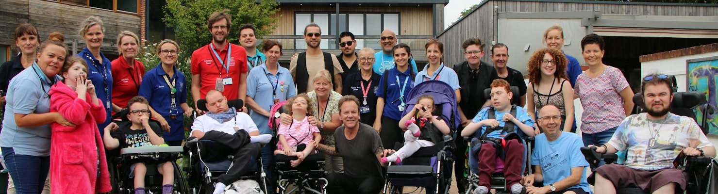 Group picture of patients and staff at Naomi House & Jacksplace hospice