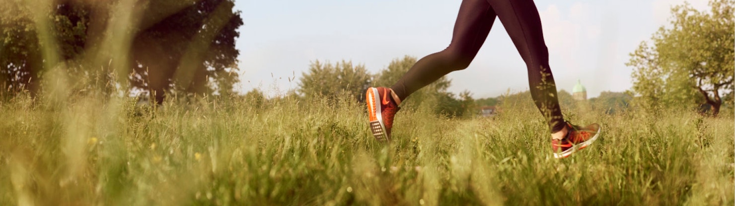Person running in long grass