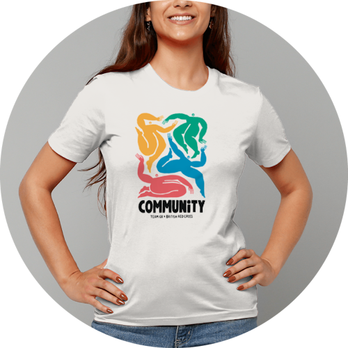 Woman wearing white t-shirt with multicoloured design on front.