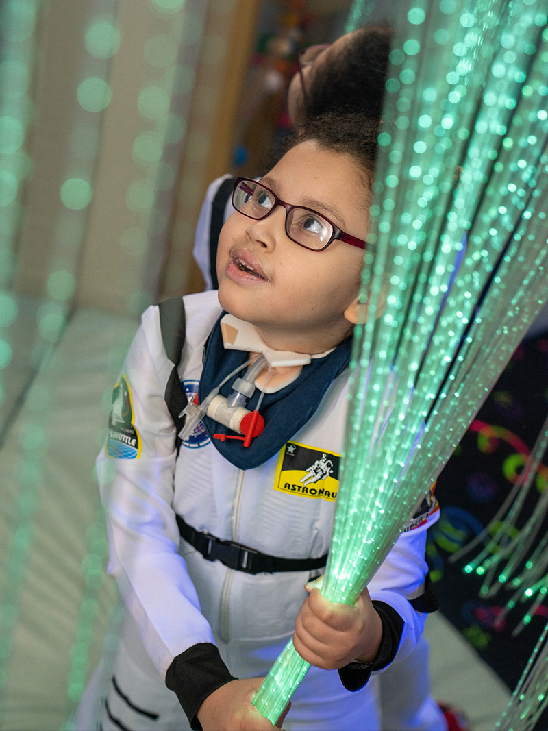 Anais in her spacesuit having fun in our sensory room. 