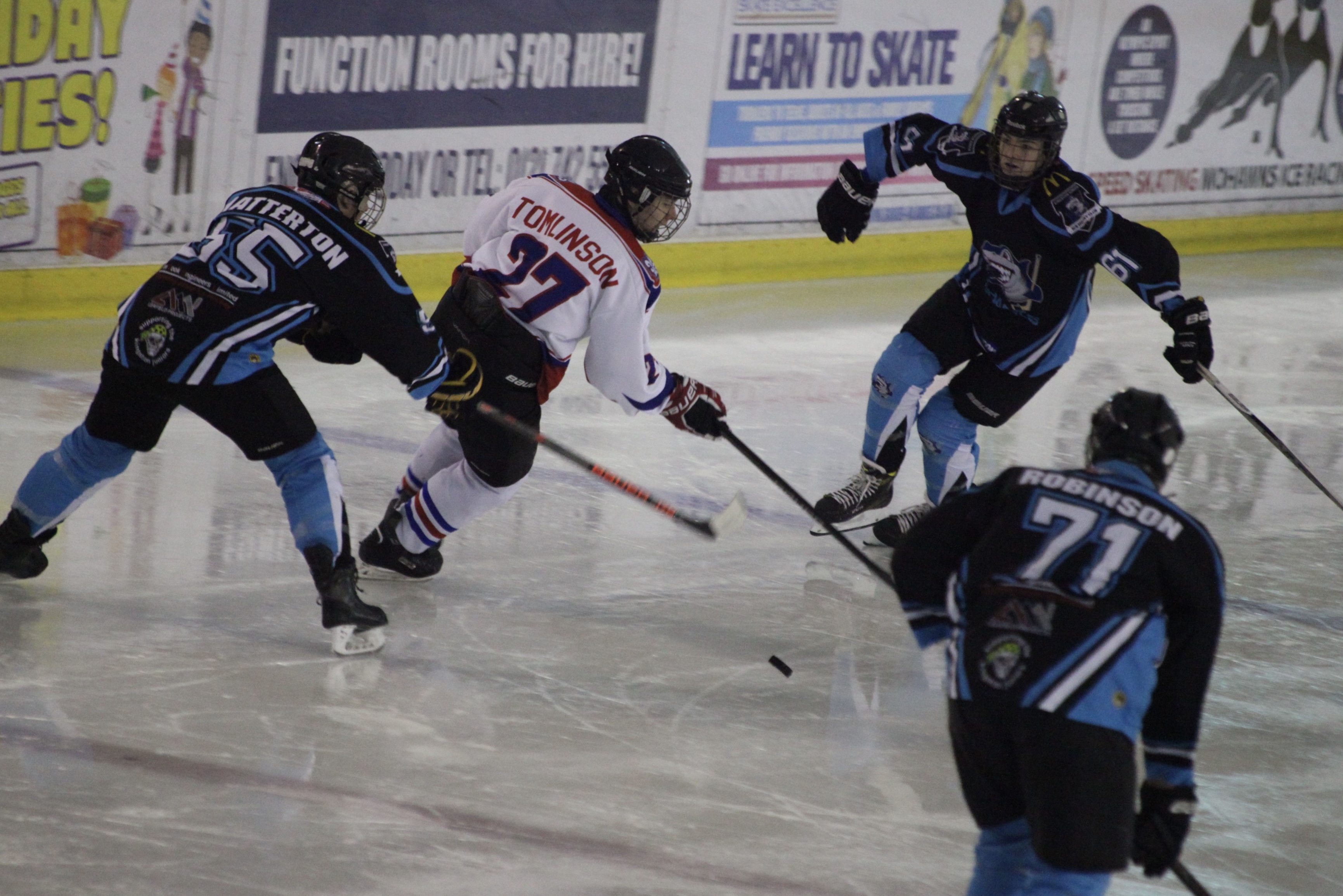James Tomlinson playing ice hockey