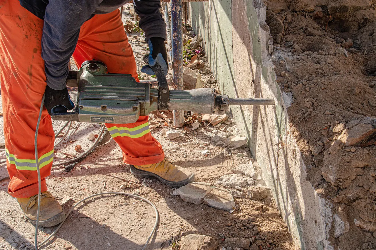 man working on a wall