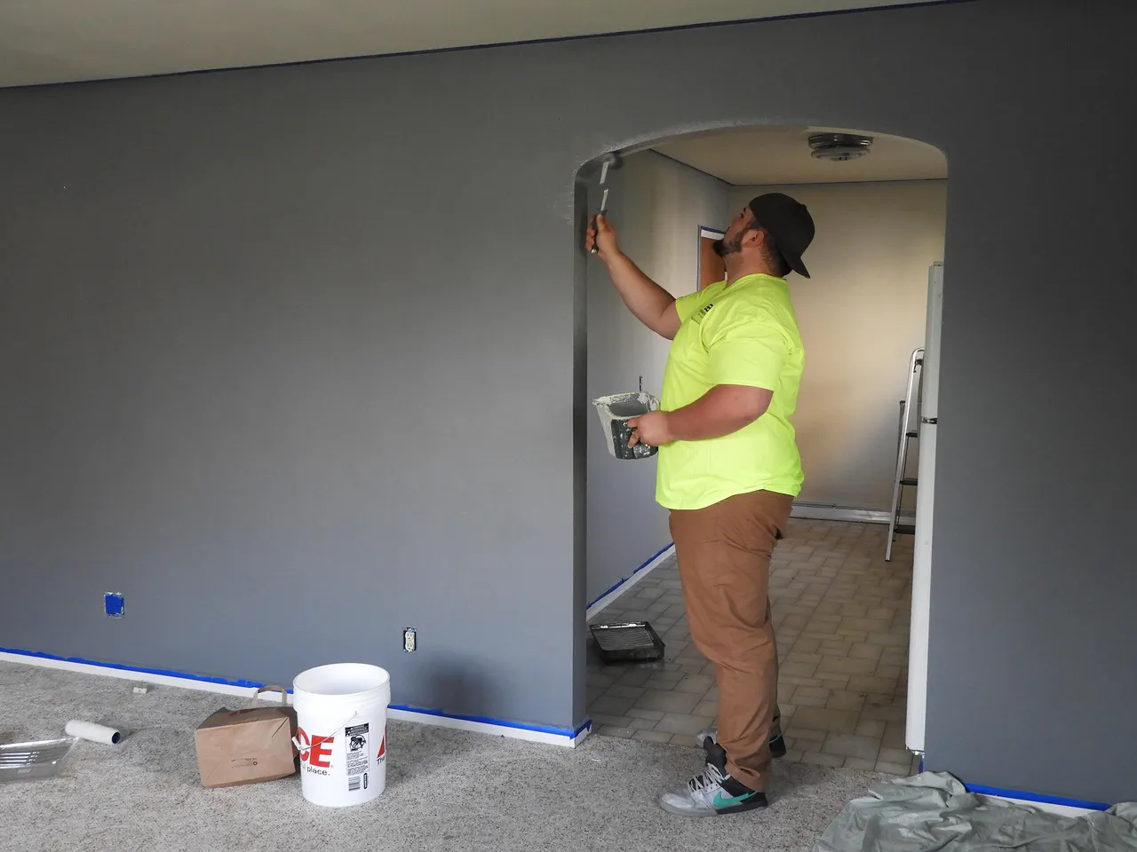 man painting a wall