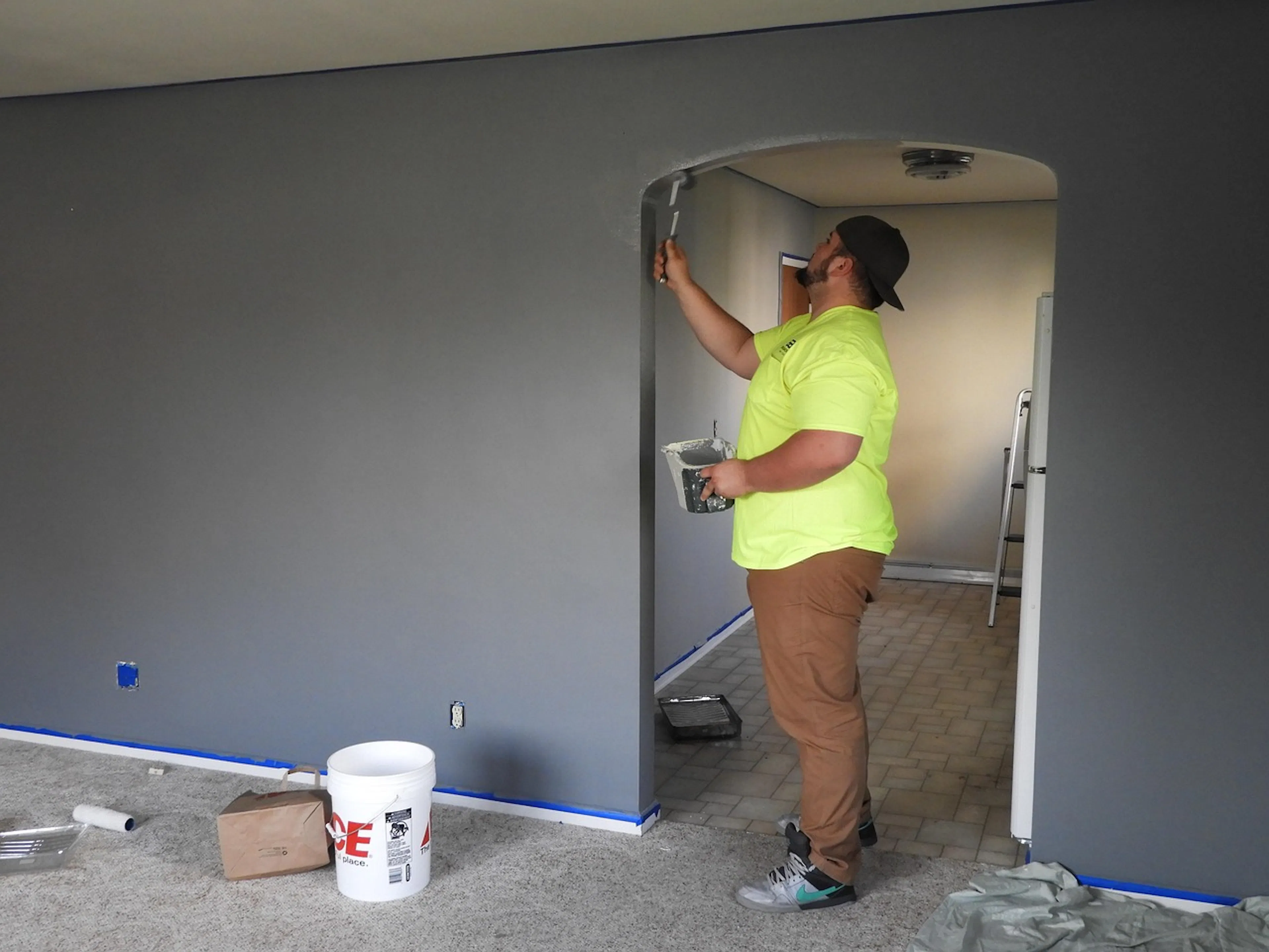 man painting a wall