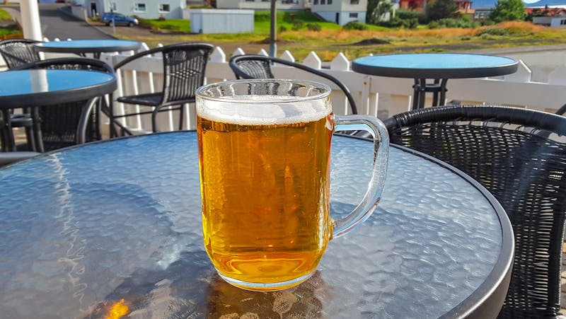 Beer glass on a table outside