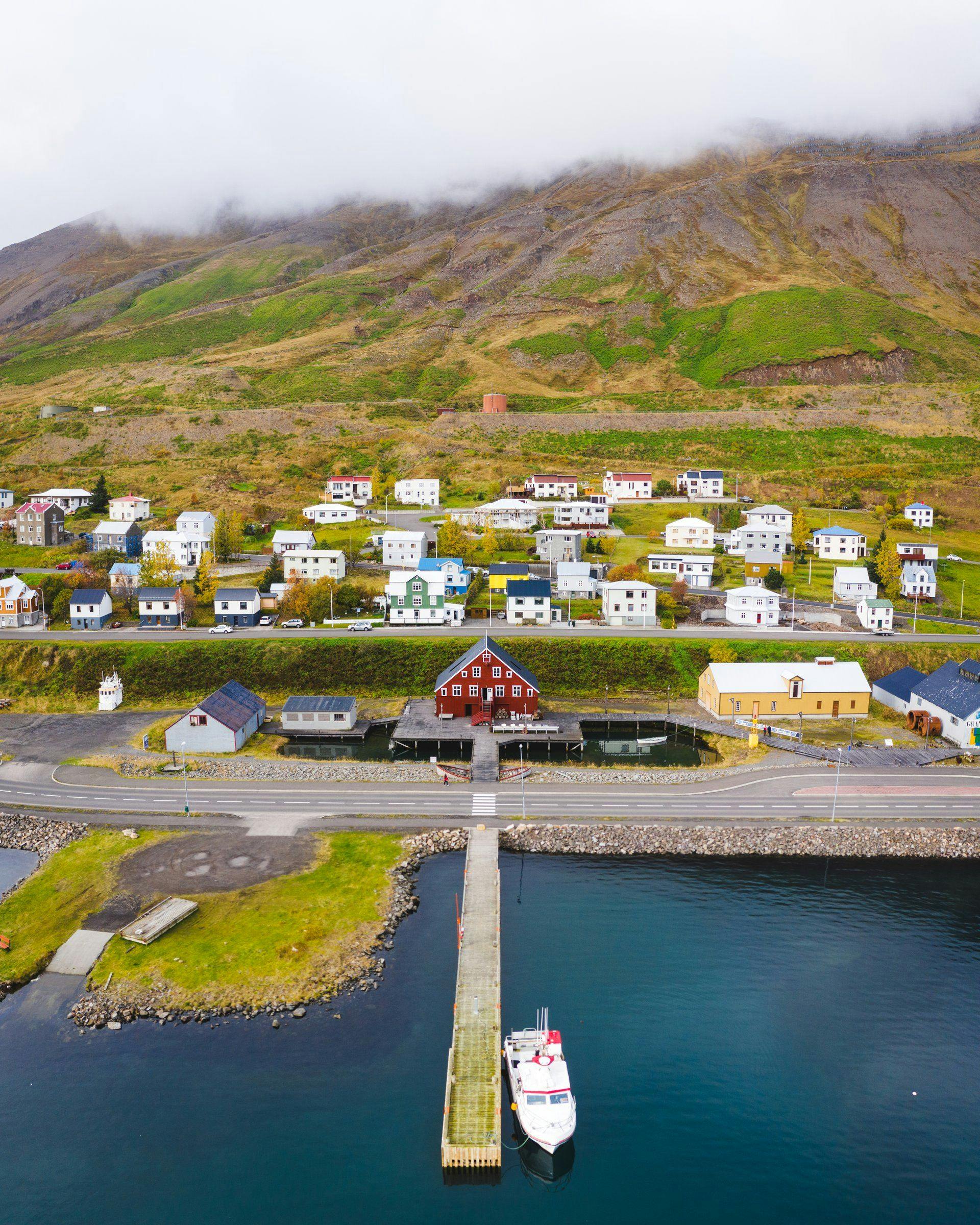 A panorama view on Siglufjörður showing the herring museum, a part of the harbour and houses in the background