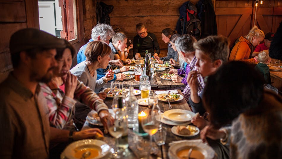 People dining at Tjöruhúsid restaurant in Ísafjördur