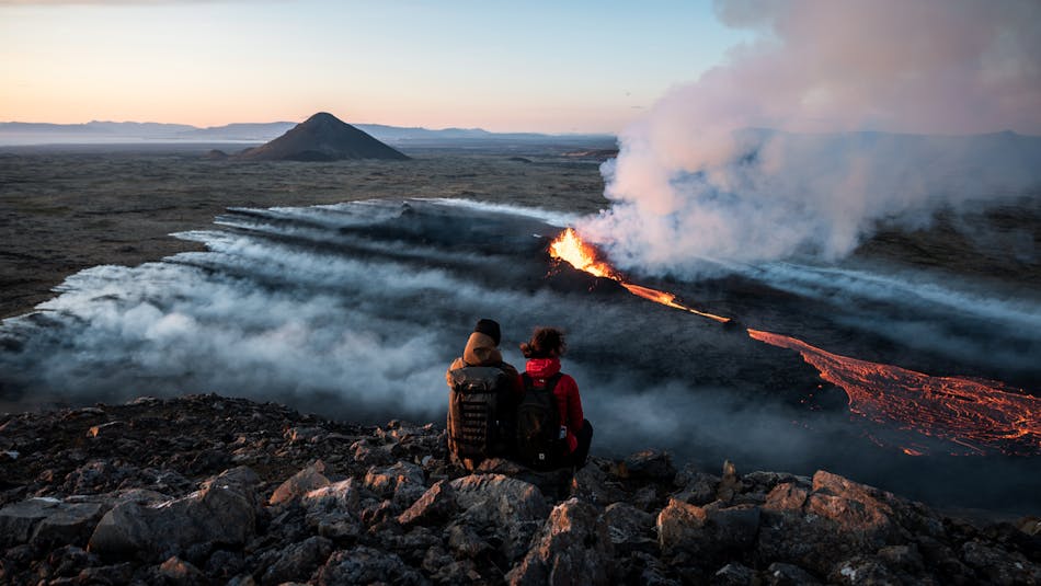A couple witnessing the start of the LitliHrútur eruption in Iceland