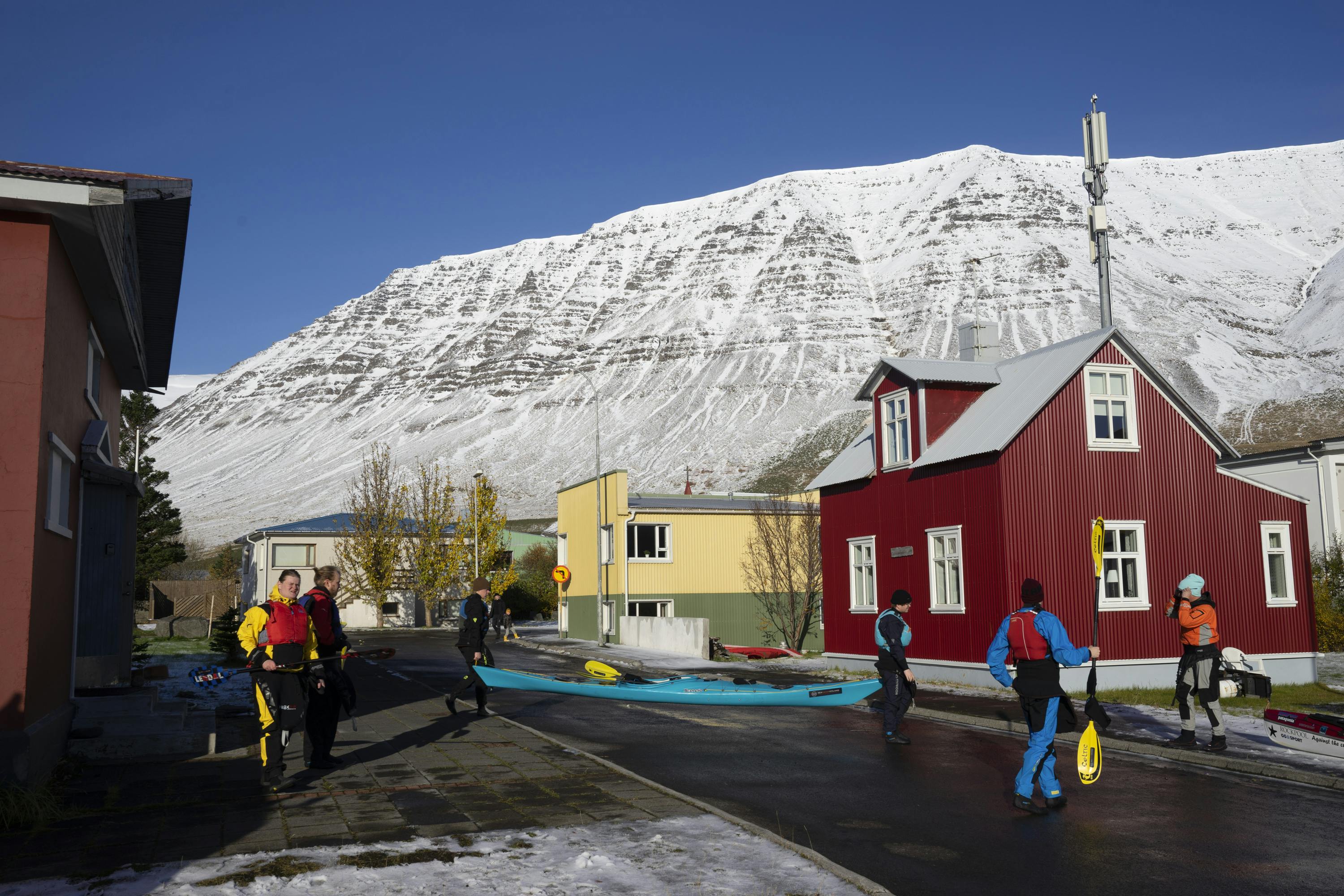Students at the Flateyri Folk High School preparing for a kayak trip