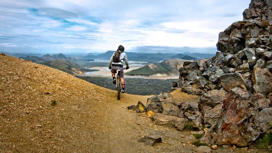 A man cycling on Iceland's mountains