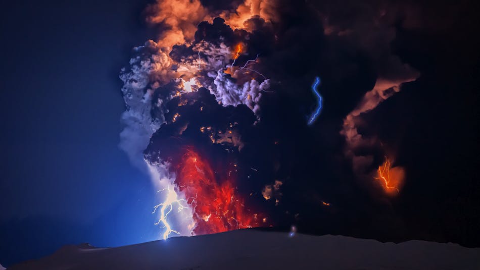 Black and red ash-cloud with blue flashes of lightning